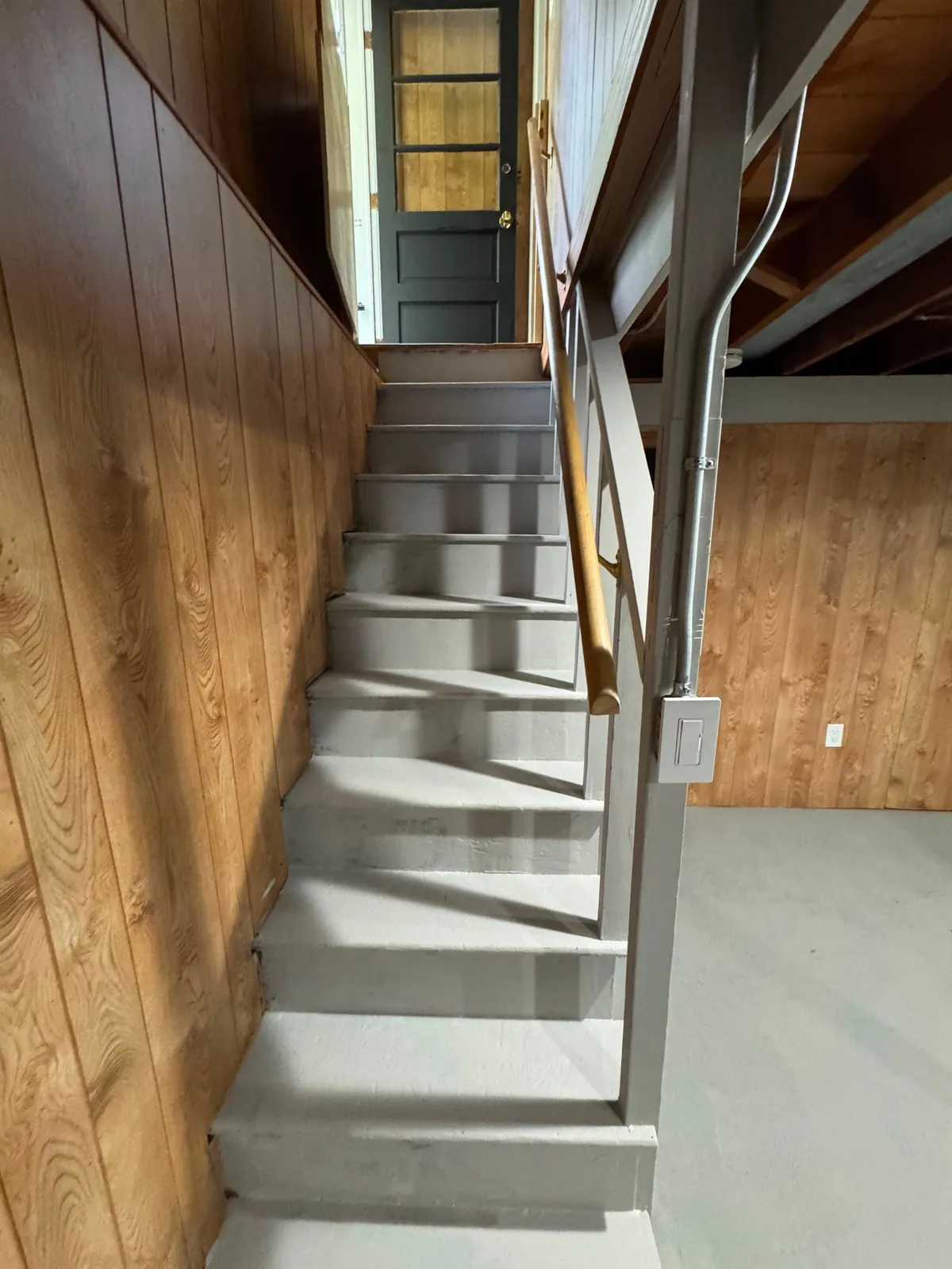 Freshly painted basement stairs after