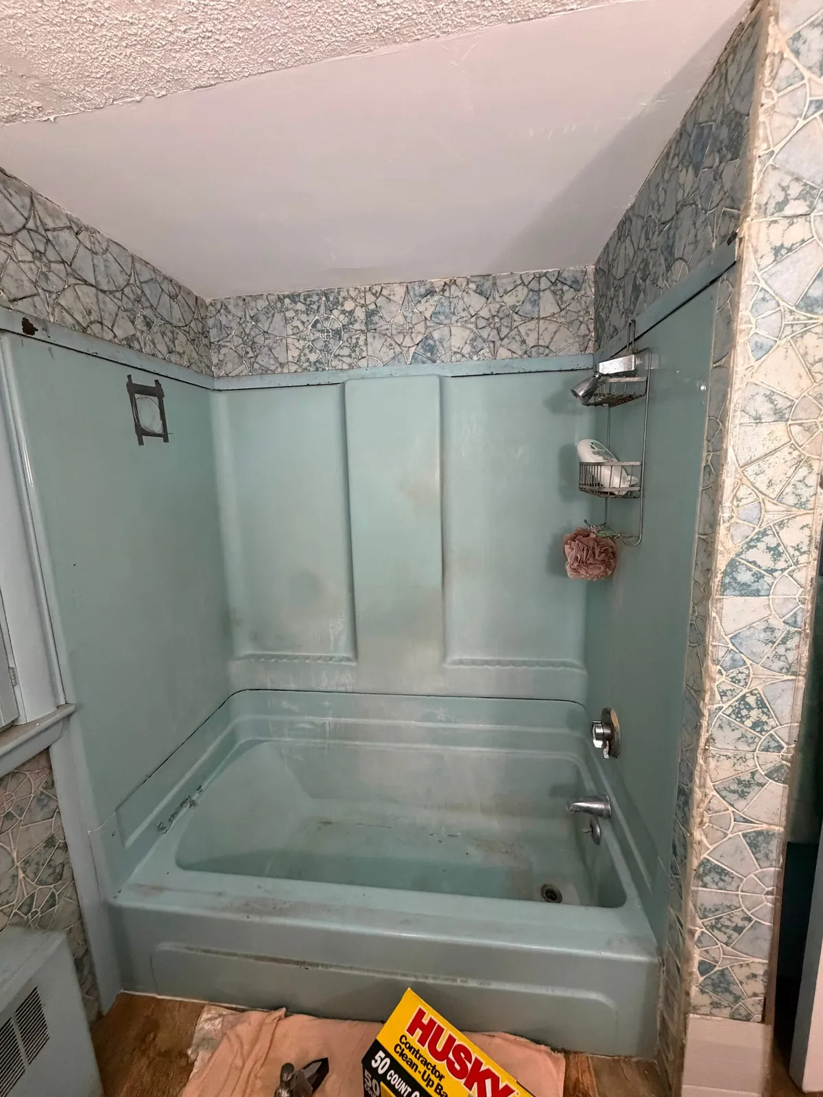 Old bathroom with vintage tub before remodel