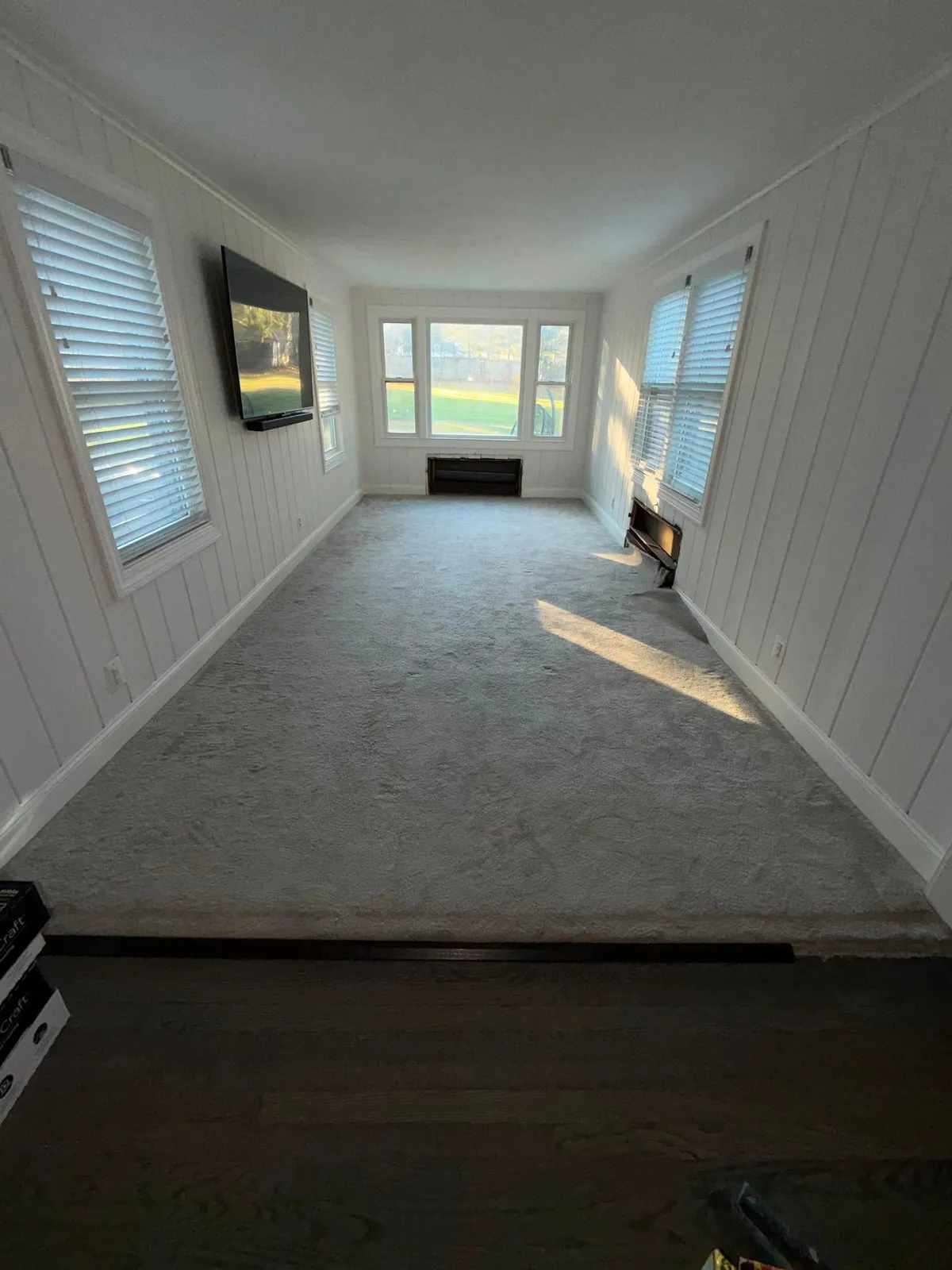 Sunroom mid-project during flooring replacement